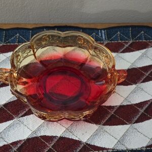 Vintage Jeannette Glass Amberina candy bowl featuring the Aztec Rose pattern